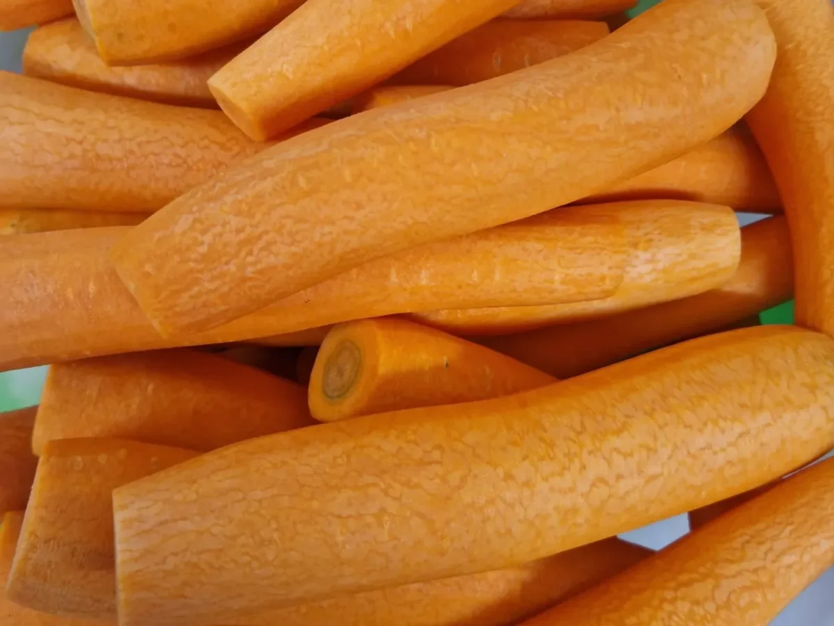 Freshly prepared whole peeled carrots