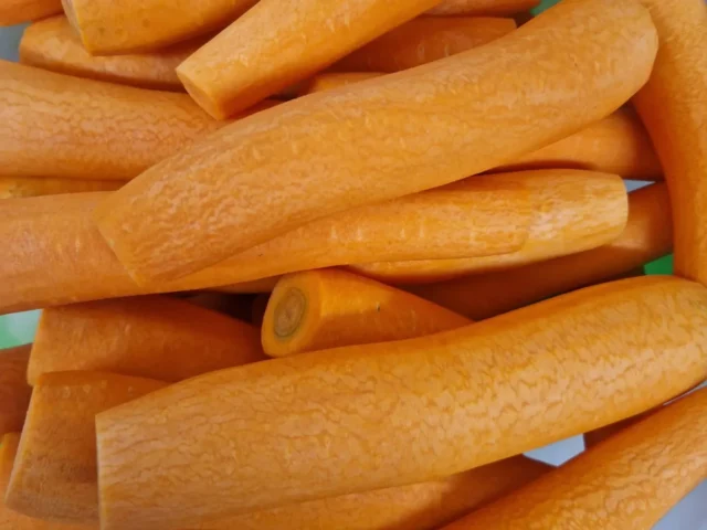 Freshly prepared whole peeled carrots